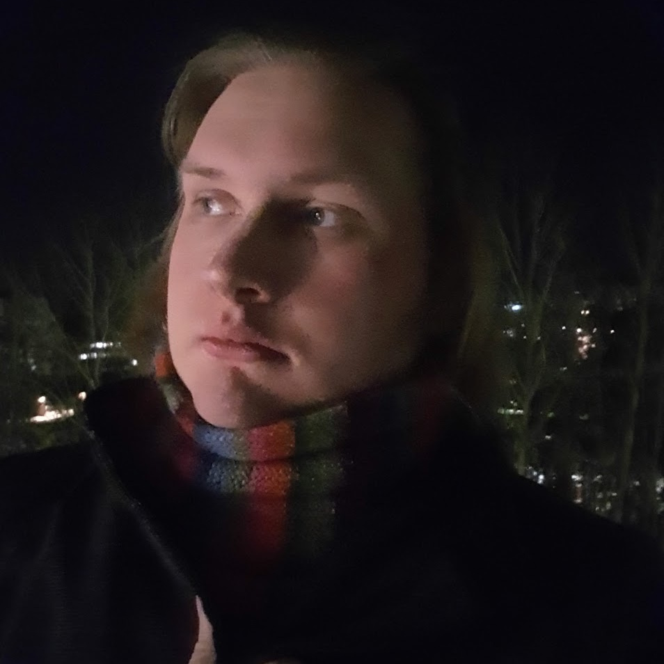 My portrait outside in a coat and scarf